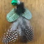 Christmas Cat Gift featuring feathered toy attachment with green bell and decorative accents.