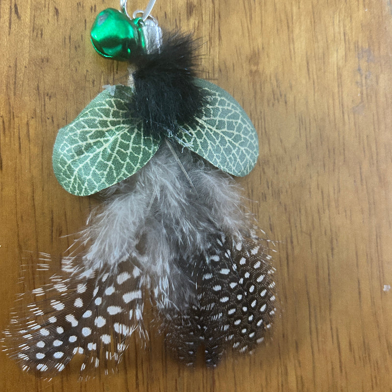 Christmas Cat Gift featuring Scrub Skipper teaser attachment with green wings and feather details.