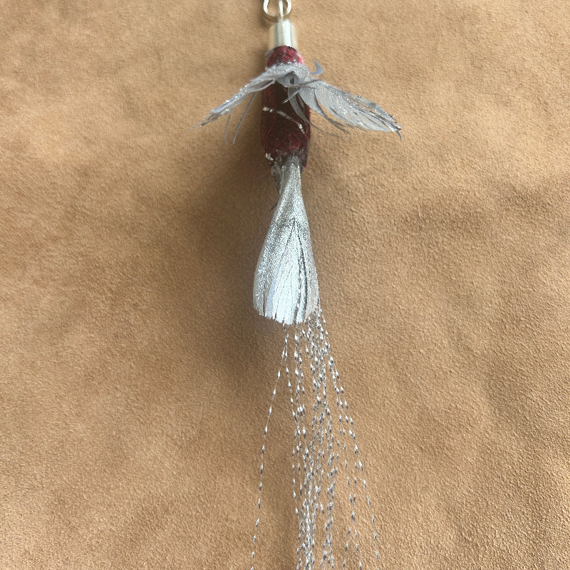 Handcrafted Silver Wisp attachment for Christmas Cat Gift, featuring shimmering feathers and intricate design.