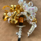 Christmas Cat Gift with colorful ribbons and a whimsical design for feline play and entertainment.