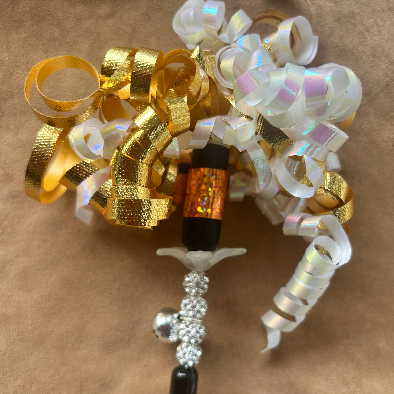 Jingle Wand, a Christmas cat gift with colorful curls, beads, and jingles for playful feline fun.