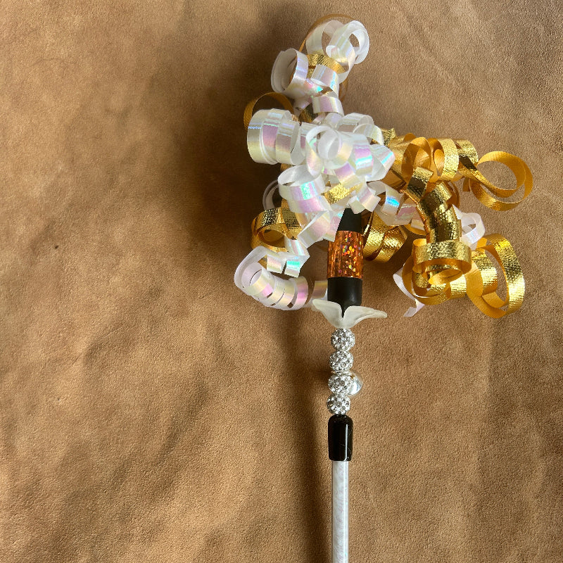 Jingle Wand, a handmade Christmas cat gift with colorful ribbons and sparkling beads for feline playtime.