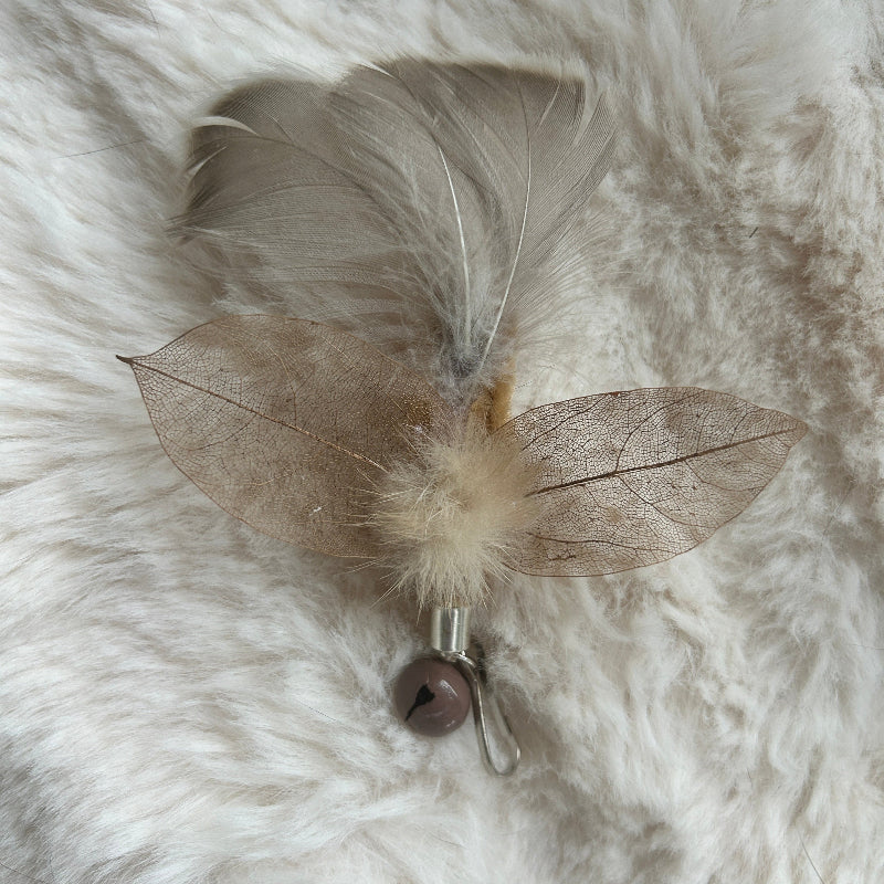 Aussie Bush cat toy - Bush Moth attachment featuring feathers and leaves for engaging feline play.